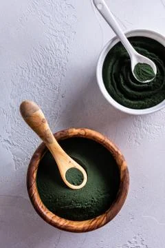 Chlorella or spirulina in two different bowls Stock Photos