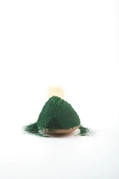 Chlorella single celled green algae. Detox superfood on the white background Stock Photos