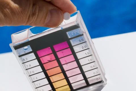 Chlorine and ph testing in pool Stock Photos