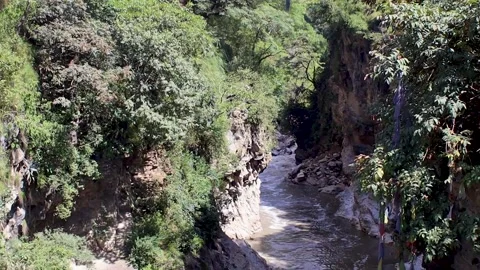 Chobar gorge with prayer flags and bridge Stock Footage 219304325