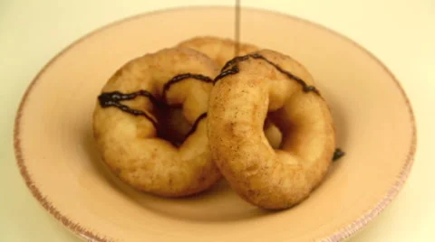 Choc Sauce Poured On Donuts Stock Footage 55186876