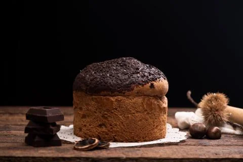 Choccolate panettone on a rustic table Stock Photos