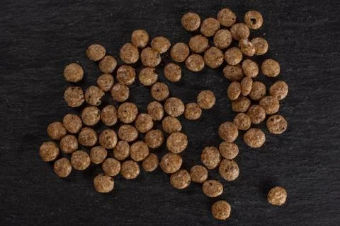 Choco balls cereal on grey stone Foto stock