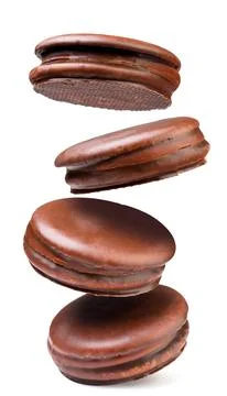 Choco pie biscuit falling close-up on a white background. Stock Photos