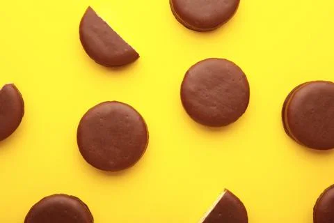 Choco pie chocolate coated snacks on yellow background. Stock Photos