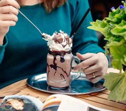 Chocolade milkshake with kitkat on the table Stock Photos