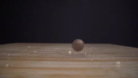 Chocolade sphere falling down on table macro closeup Stock Footage 124018250