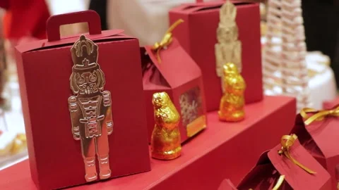 Chocolate and candy boxes with nutcracker and rabbit decor, Christmas theme Stock Footage 286428397