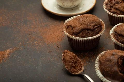 Chocolate and cocoa browny muffins with coffee cappuccino in cup angle view on Stock Photos