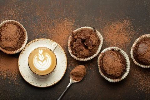 Chocolate and cocoa browny muffins with coffee cappuccino in cup top view on Stock Photos
