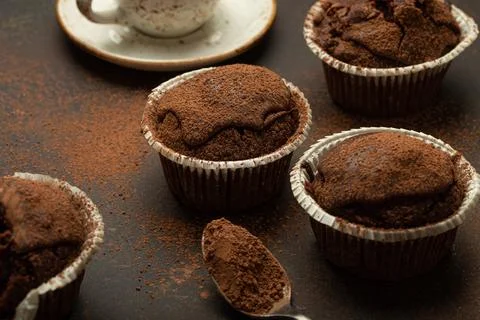 Chocolate and cocoa browny muffins with coffee cappuccino in cup angle view on Stock Photos