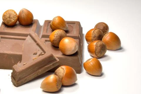 Chocolate and hazelnuts Stock Photos