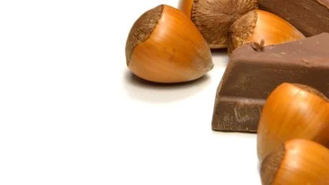 Chocolate and hazelnuts Stock Photos
