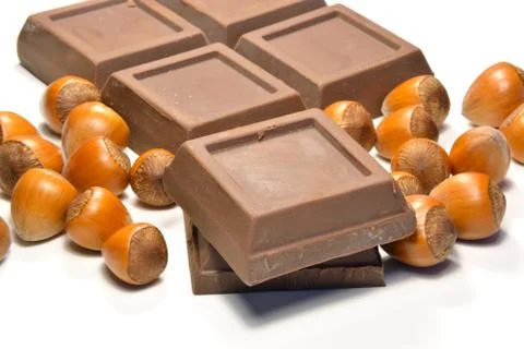 Chocolate and hazelnuts Stock Photos