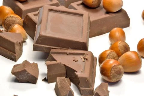 Chocolate and hazelnuts Stock Photos