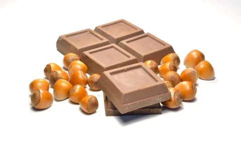 Chocolate and hazelnuts Stock Photos