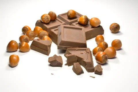 Chocolate and hazelnuts Stock Photos
