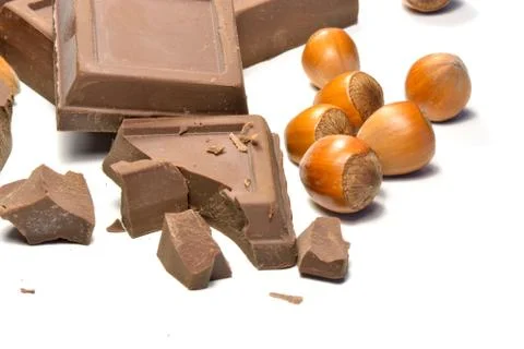 Chocolate and hazelnuts Stock Photos