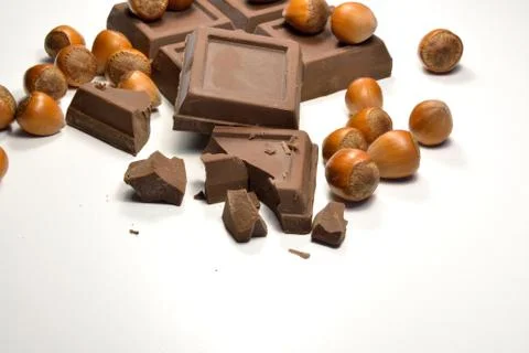 Chocolate and hazelnuts Stock Photos