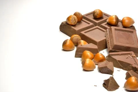 Chocolate and hazelnuts Stock Photos