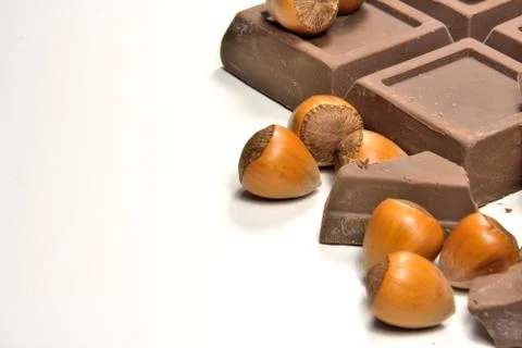 Chocolate and hazelnuts Stock Photos