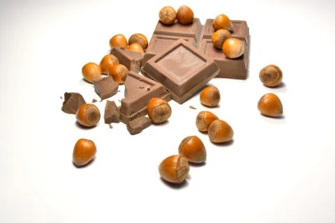 Chocolate and hazelnuts Stock Photos