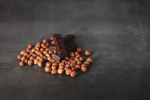 Chocolate and hazelnuts Stock Photos