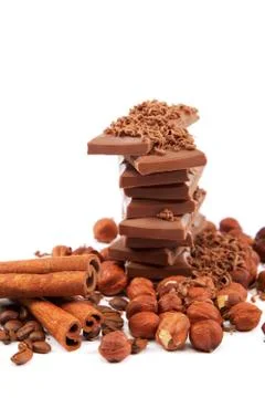 Chocolate and nuts on white background. Stock Photos