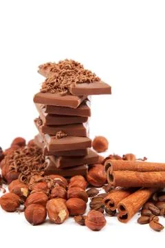 Chocolate and nuts on white background. Stock Photos