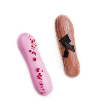 Chocolate and raspberry eclairs isolated on white background Chocolate and... Stock Photos