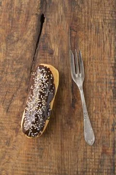 Chocolate and sprinkles eclair Stock Photos