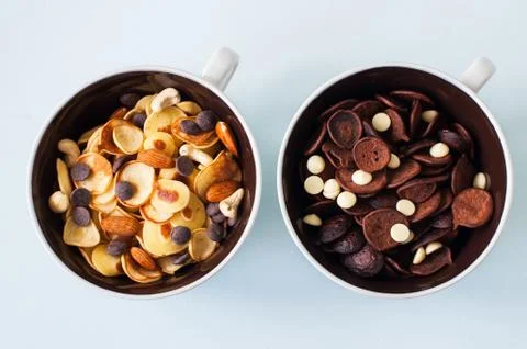 Chocolate and vanilla tiny pancake cereals in a bowls. Stock Photos