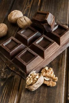 Chocolate and walnuts Stock Photos