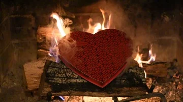 Chocolate assortment box on fire faster Stock Footage 86146144
