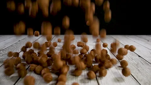 Chocolate balls falling on the table in slow motion Video stock 140233218