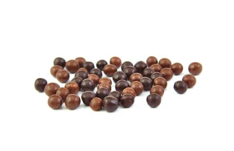 Chocolate balls on a white background. Stock Photos