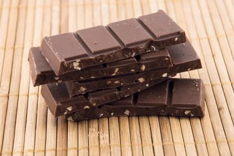 Chocolate on a bamboo mat Stock Photos