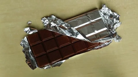 Chocolate bar breaking into pieces Stock Footage 134961147