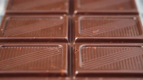 Chocolate bar. Camera moves forward above chocolate slices 스톡 동영상 146288312