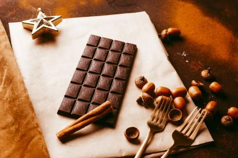 Chocolate bar on a dark brown background Stock Photos