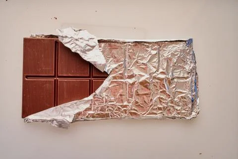 Chocolate bar in foil Stock-Fotos