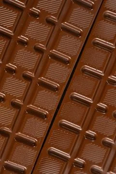 Chocolate bar with geometric line pattern, texture macro background Stock Photos