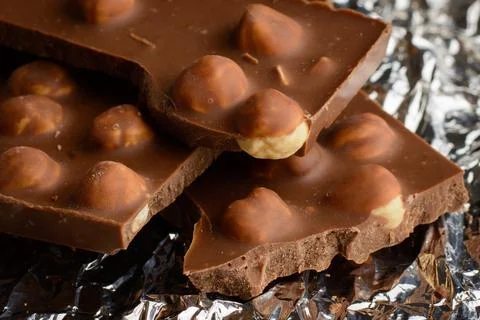 Chocolate bar with a lot of nuts Stock Photos