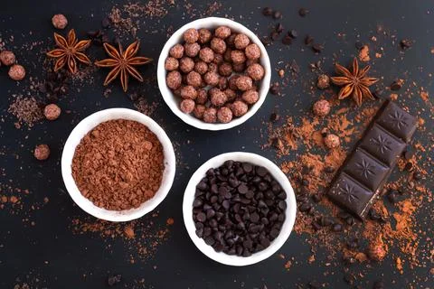 Chocolate bar pieces with ingredients for cooking sweet food top view Stock Photos