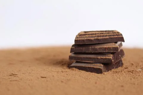 Chocolate bar pieces lie a stack of slides on each other day chocolate kind o Stock Photos