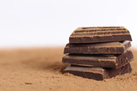 Chocolate bar pieces lie a stack of slides on each other day chocolate kind o Stock Photos