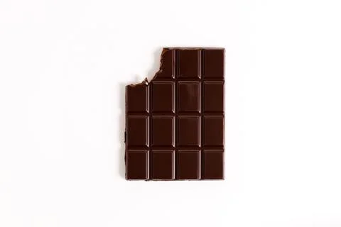 Chocolate bar with teeth bite on white background Foto stock