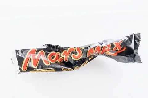 Chocolate bar wrapper mars crumpled on white background Stock Photos