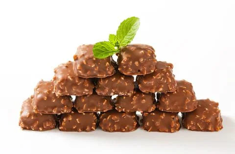 Chocolate bark pieces with mint leaf on top Stock Photos
