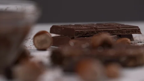 Chocolate Bars and a Slice of Bread with Hazelnut Chocolate Spread Stock Footage 110844964